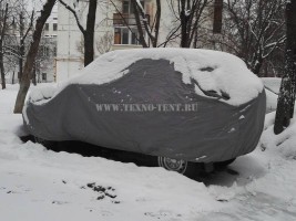 Премиум тент для автомобиль Chevrolet Niva для хранения автомобиля в зимний период светло-серого цвета из ткани Оксфорд 240den. На фото тент в использовании три года.